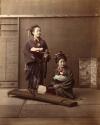 Two young Japanese women in traditional dress, with musical instruments