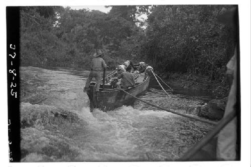 Boat going over rapids