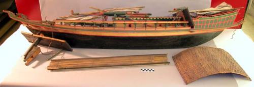 Boat model, carved and painted, multiple pieces, cotton sails with cannons