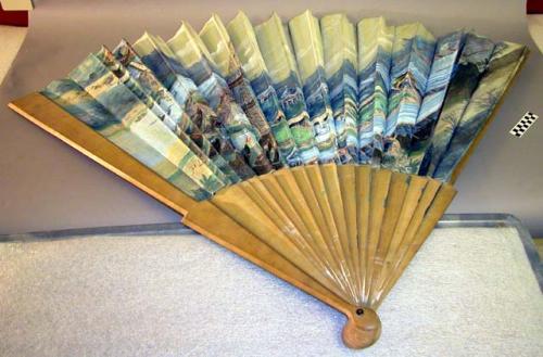 Fan, painted silk with scene of Paris, wood blades with button and metal rod