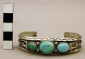 Cuff bracelet, narrow silver band w/ stamped decoration set w/ turq. stones