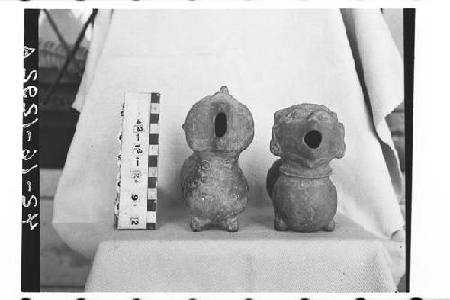 2 animal-effigy ocarinas(?), each with 4 finger holes.