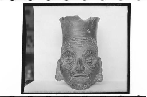 Plumbate head jar, bearded; max. ht. 16.0cm.; max. diam. 9.8cm.; Color: 13"m, 7