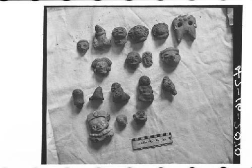 Thirteen Figurine Heads and Five Whistles