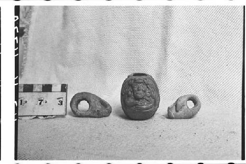 Two Small Pottery Rings and Broken Tear Flask with Human Effigy