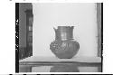 Plumbate human head jar, Button face; Max. ht. 12.3cm., max. diam. 12.1cm.; Colo