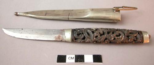 Carved handled sword in silver (?) sheath