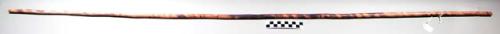 Smooth wood stick.  53 1/4" long 1 1/2" diameter.  Has charred decoration in dia