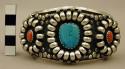 Cuff bracelet, dec. with silver half circles on end and coral & turquoise stones
