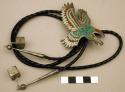 Bolo, silver in shape of an eagle with wings upright, inlaid crushed stone