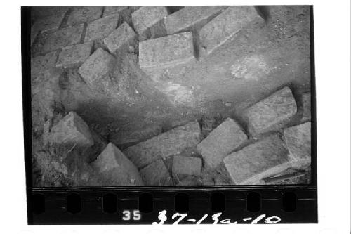 Cleared niche showing plaster flooring