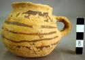 San Bernardo black-on-yellow pottery small handled jar