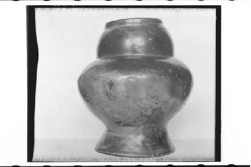 Plumbate vessel, bulging neck and annular base. Max. ht. 15.6cm., max. diam. 13.