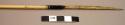 Spear, bone attached to reed shaft with sinew, notched end