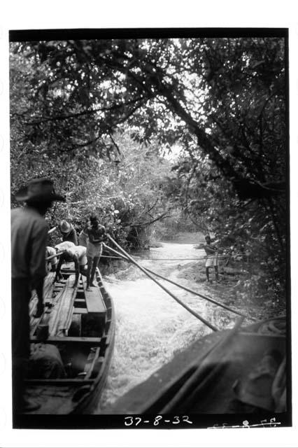 Taking boats up final rapids