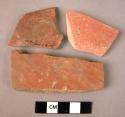 Ceramic body sherds, red slipped ware, grey core