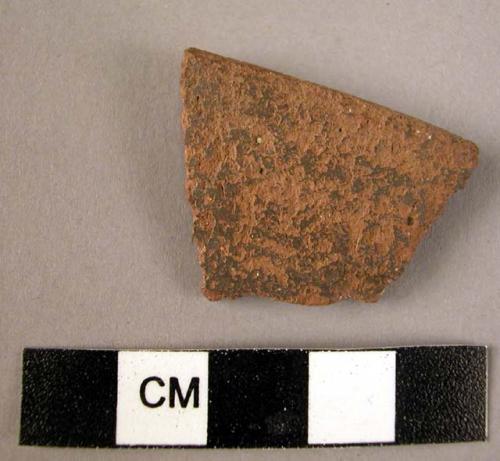 Ceramic rim sherd, red ware with traces of black slip