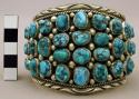 Cuff bracelet, silver band set w/ many small turquoise nuggets