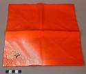 Piece of red silk with white in one corner - cloth used in tea ceremony