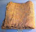 Trade bundle containing two nets wrapped in bark cloth (bought for +