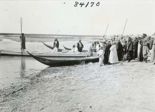 Life scene next to river bank with group of Marsh Arab men from  Beidah area