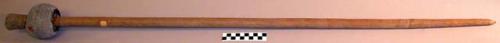 Club - long pointed wooden stick with grey stone ball at one end, +