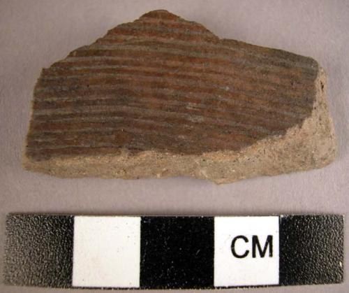 Incised potsherd