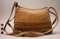 Basketry pouch of 3 sections with cord handle
