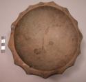 Carved wooden bowl with scalloped edges. D: 17-19 cm. H: 7 cm.