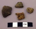 Ceramic body sherds, impressed and incised (?) designs