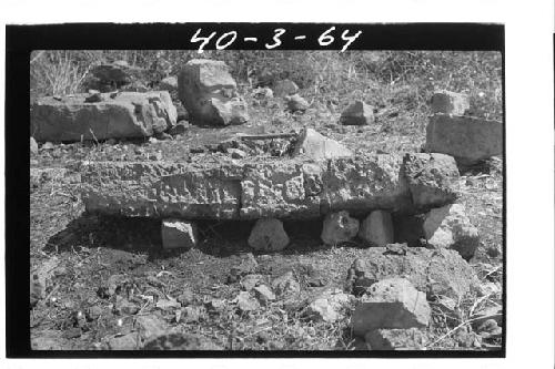 W. sculptured lintel, side (Feet to right)  N. end Ridge Group, Xkupaloma.