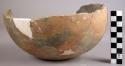 Fragmentary base of plain pottery olla