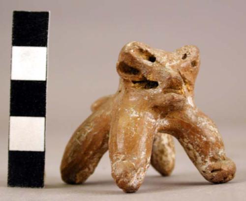 Clay figurine representing cat-like animal