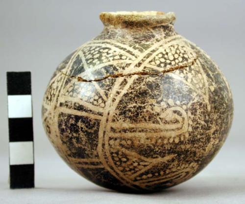 Small spherical pot, geometric design in black and white, lost color technique.