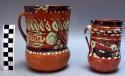 Red-brown jugs with white painted designs (3)