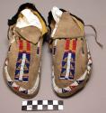 Pair of moccasins, possibly Ute. Hard soles w/ leather uppers.