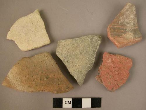 16 plain potsherds (red, buff, black)