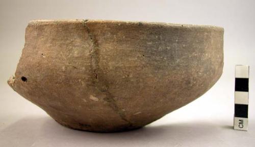 One-half of pottery bowl - undecorated, one handle