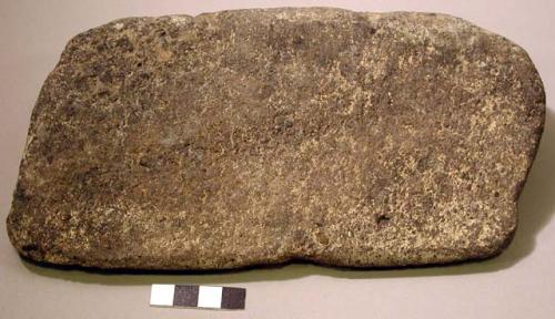 Stone mano, two grinding surfaces, triangluar cross section, burnt black