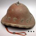 Helmet-shaped hat with metal decoration