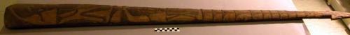 Large dance wand in cork-like wood with incised human figures