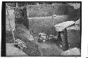 General view of excavation with urn burial and huge boulder