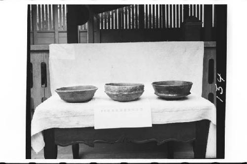 Three pottery vessels from tomb in ball court