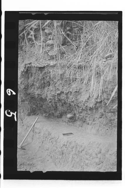 Early stratum in river bank below pottery deposits