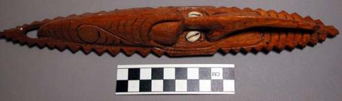 Carved wooden mask elongate oval in shape with inlaid cowrie shell "eyes" with p