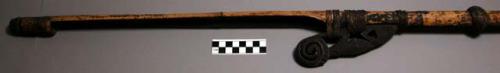 Bamboo stick with added wooden carved ornamentation - lime stick?