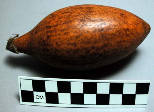 Gourd lime container, decorated with red glass beads