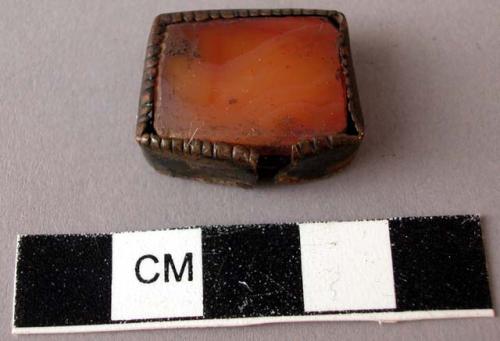 Jewelry fragment, squared brass setting, inlaid with pink glass