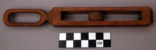 Ornament, carved wood, oval loop, caged wood ball in rectangular link