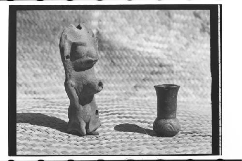 Orange-red plumbate? miniature vessel, and animal effigy whistle. Whistle-13 cms